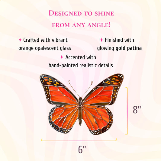 An orange and black patterned butterfly ornament centered on a pale pink background with size markers showing 6 inches wide by 8 inches tall.