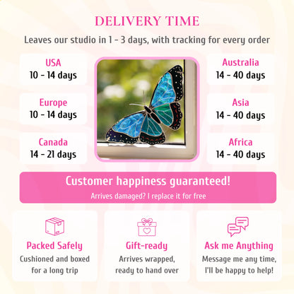 Delivery info for the blue morpho stained glass window corner, pictured in a window. Ships from the studio in 1-3 days with tracking. Delivery: USA and Europe 10-14 days, Canada 14-21 days, Australia, Asia and Africa 14-40 days. If it arrives damaged, it is replaced for free. Cushioned and boxed for the trip, arrives gift-wrapped, and you can message the maker any time.