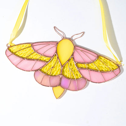 Stained glass luna moth suncatcher with yellow ribbon and iridescnt details
