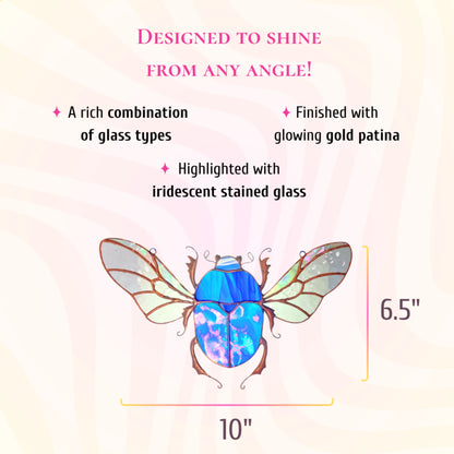 This dimensions infographic indicates the stained glass blue scarab beetle measures 10 inches high by 6.5 inches wide, finished with gold patina.