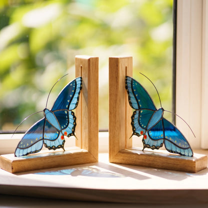 Pair of stained glass bookends with black swallowtail butterflies