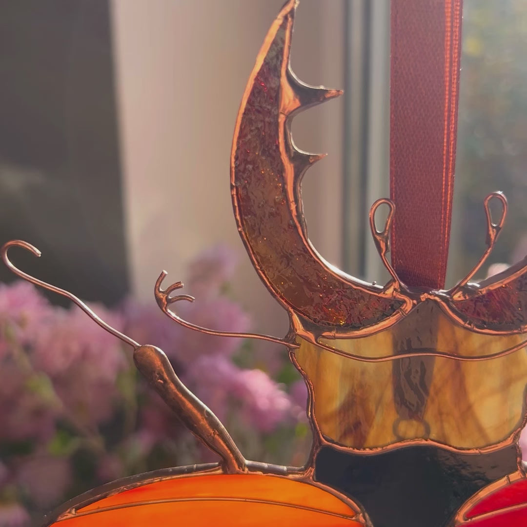 A charming video highlighting a unique stained glass stag beetle, focusing on its exquisite artistry and ability to add a touch of magic to your favorite space.