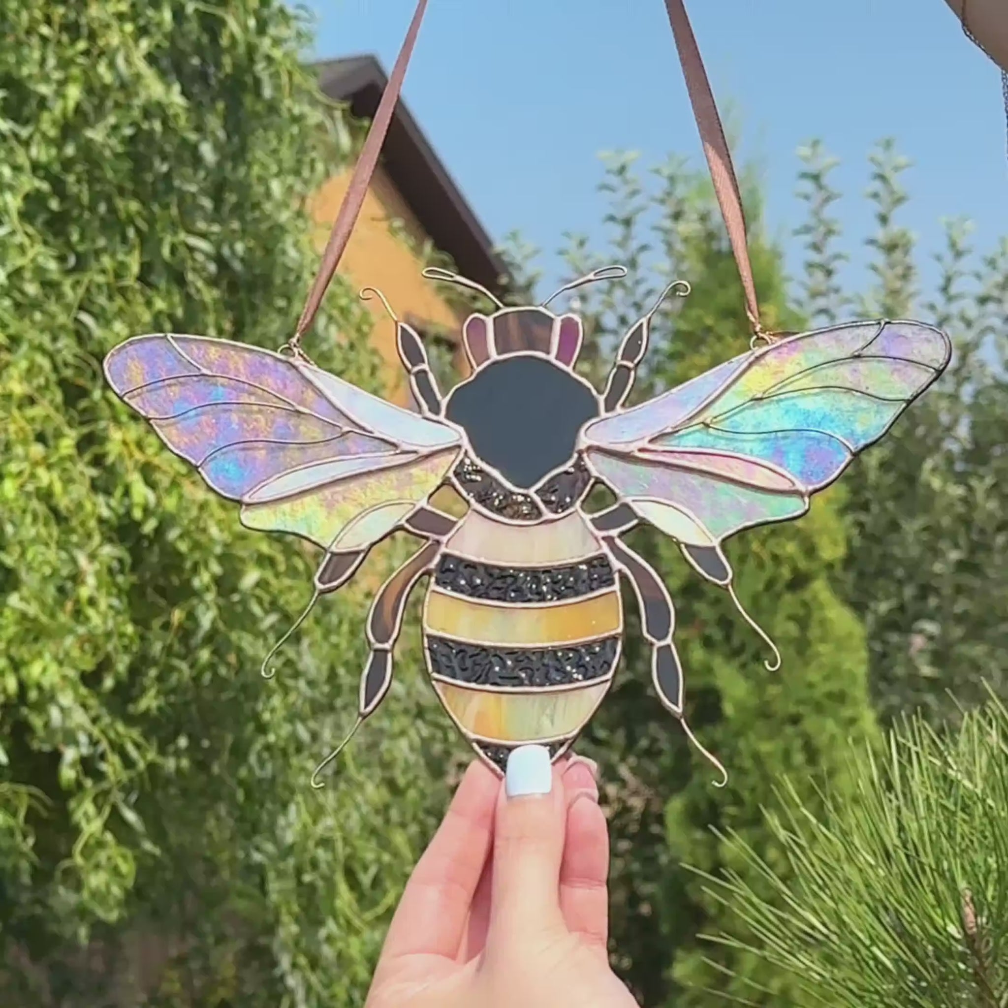 Video of stained glass bumble bee suncatcher with iridescent stained glass wings
