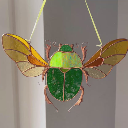 A captivating video showcasing the stunning details and vibrant colors of a handmade stained glass green scarab, highlighting its beauty as a unique and memorable gift