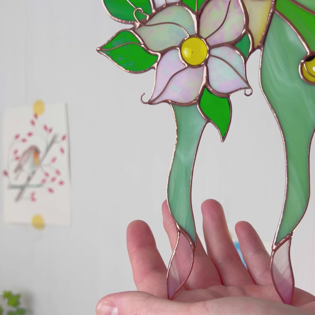 A charming video highlighting a unique stained glass luna moth suncatcher, focusing on its exquisite artistry and ability to add a touch of magic to your favorite space.